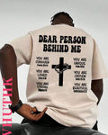 T-shirt with motivational text and a cross design on the back.